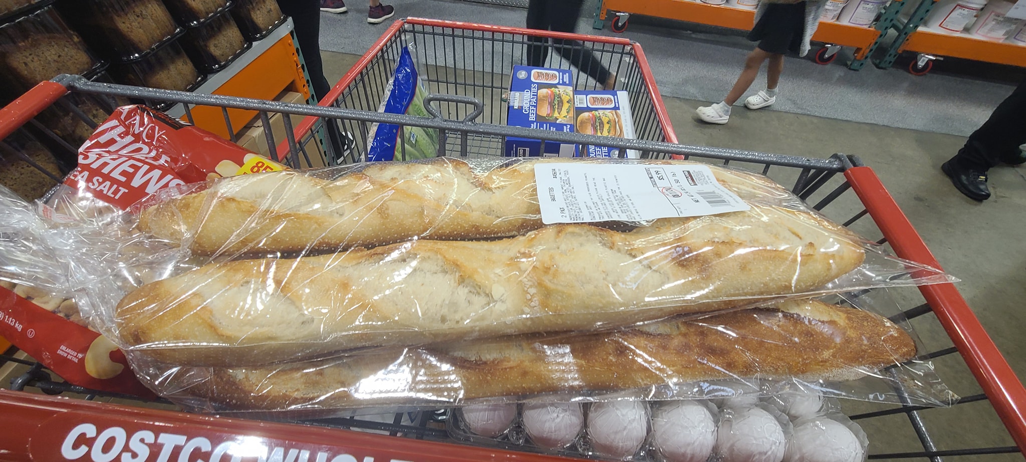 Bulk baguettes in a Costco cart during campout prep — Campout 2024
