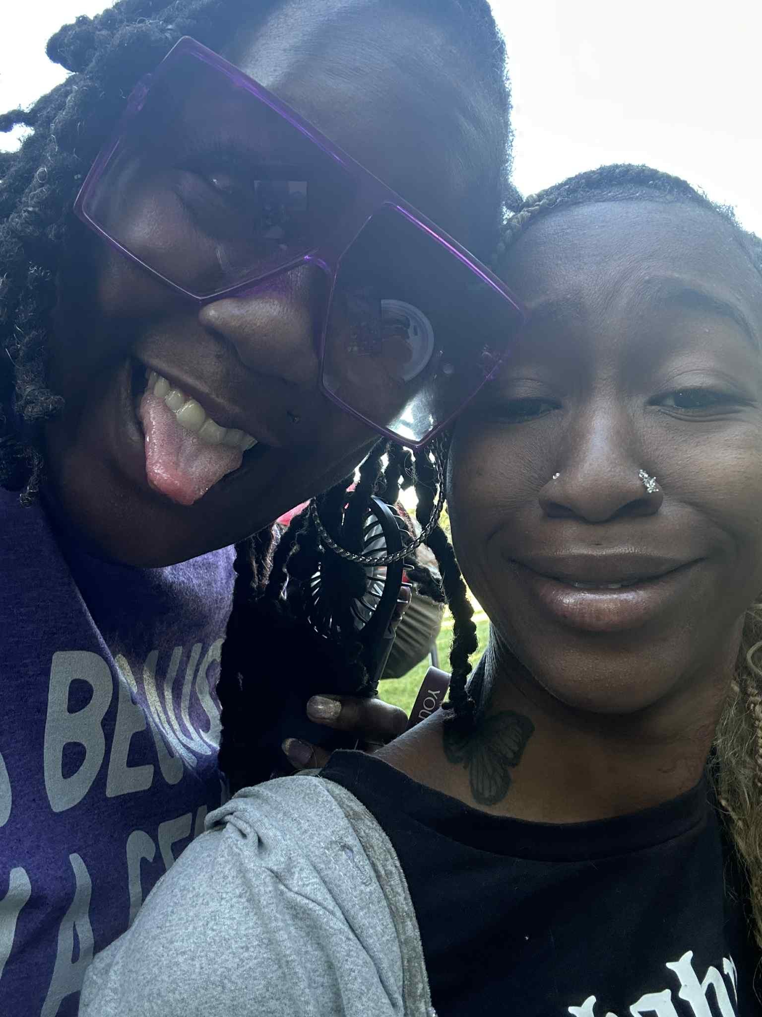 Two friends cracking up in a close-up selfie — Campout 2025