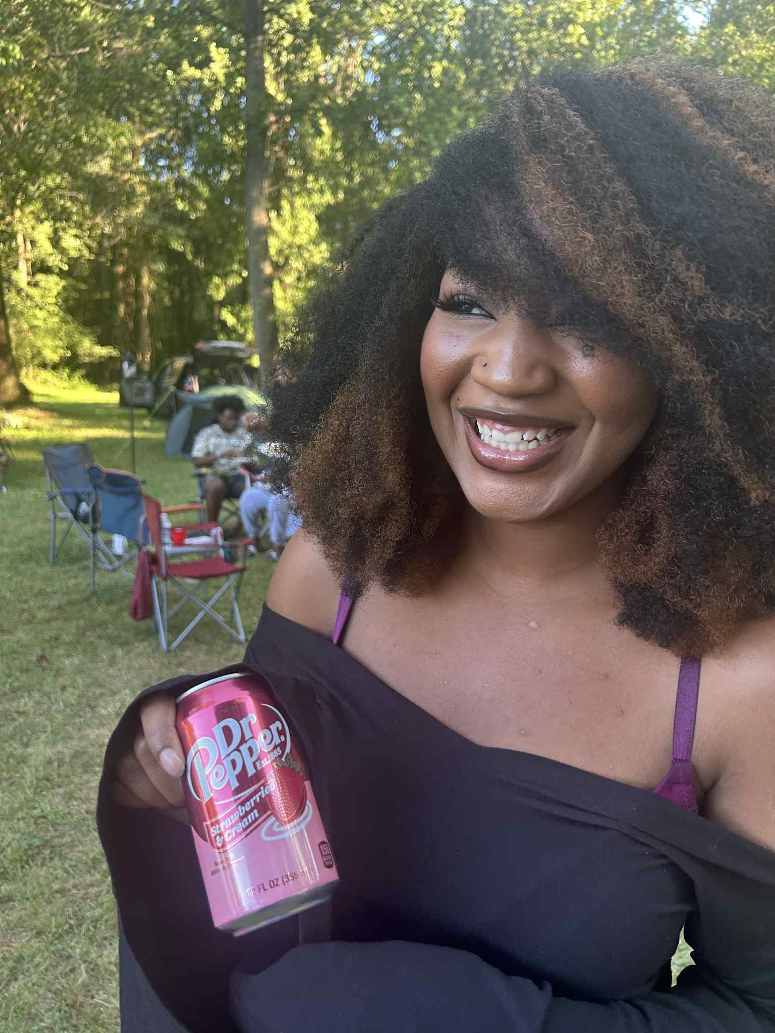 Laughing in the yard with a Dr Pepper in hand — Campout 2025